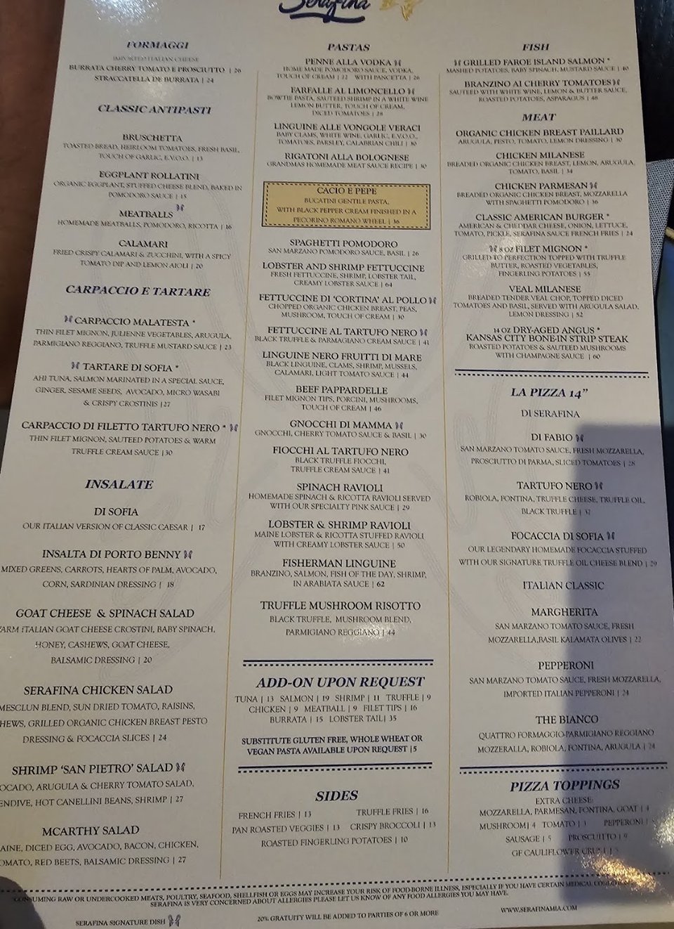 Restaurant menu with Italian dishes and wine options.